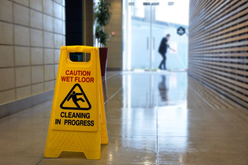 Wet floor caution sign representing slip and fall hazard
