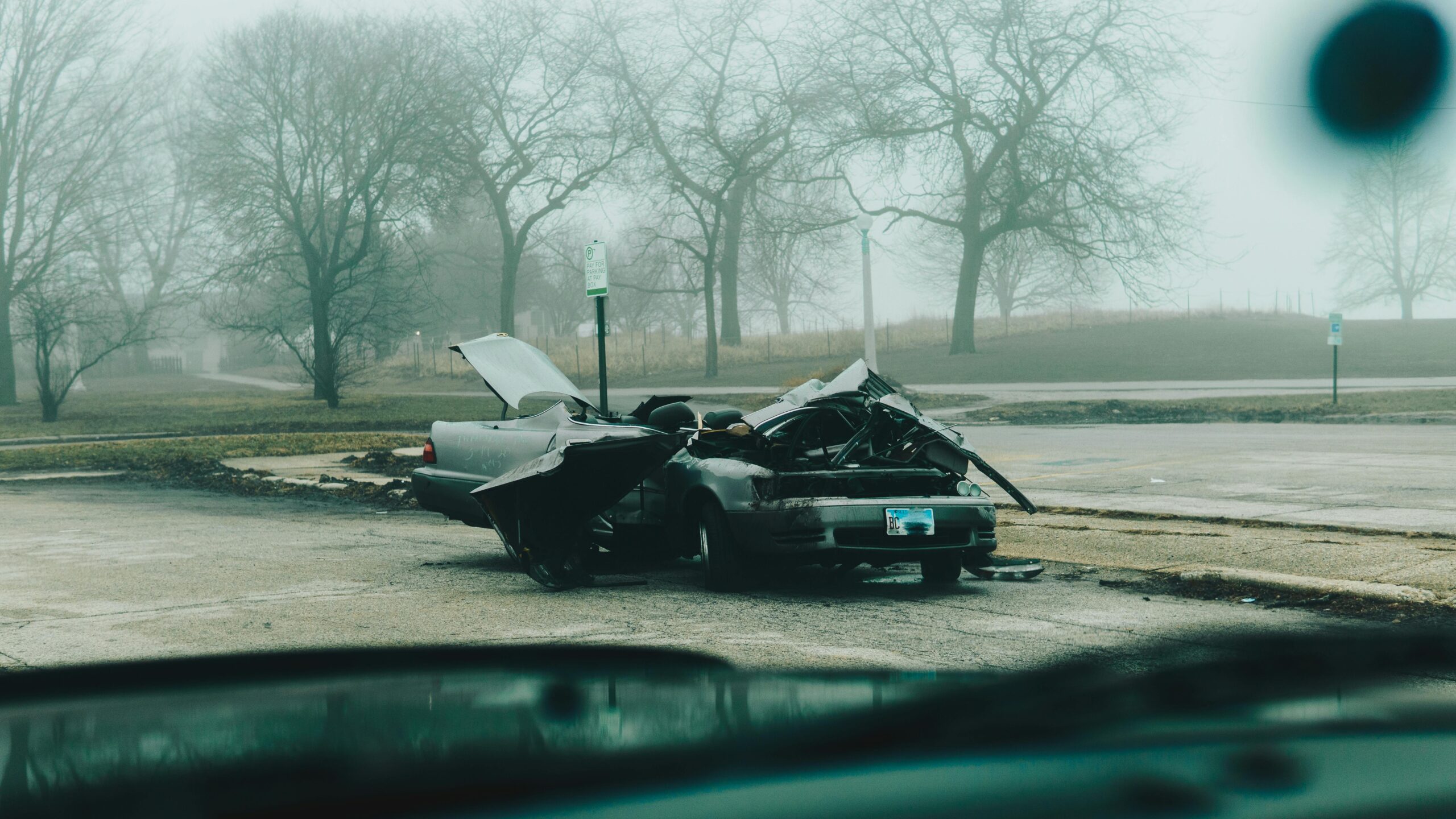 Two damaged cars after a collision on a Colorado road.