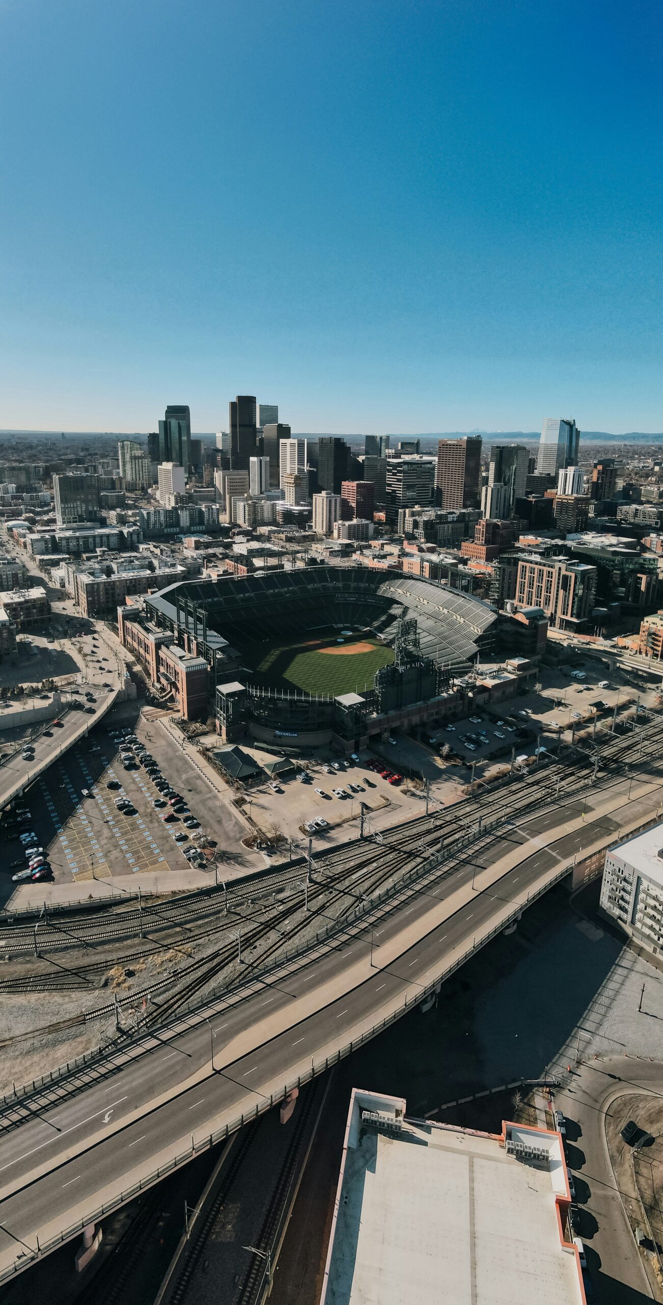 Denver Aerial Skyline with Stadium – Strong Law Attorneys