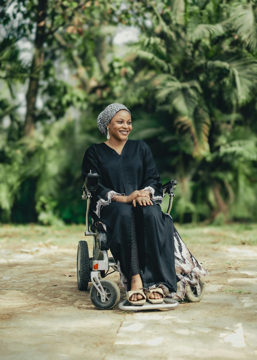 Woman using a powered wheelchair outdoors