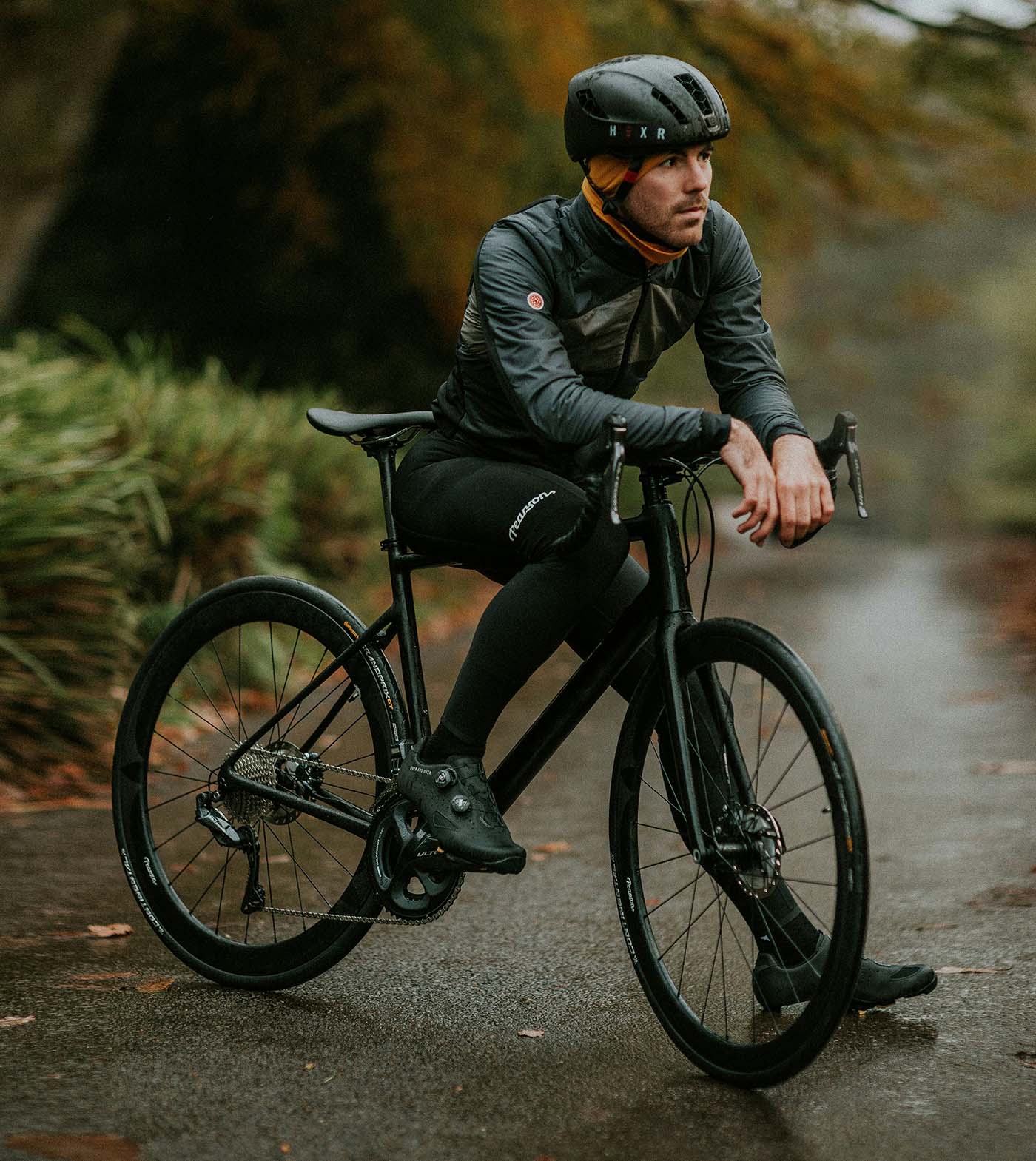 Cyclist in helmet and dark riding gear stopped on a roadway, representing an Everett bicycle accident lawyer page