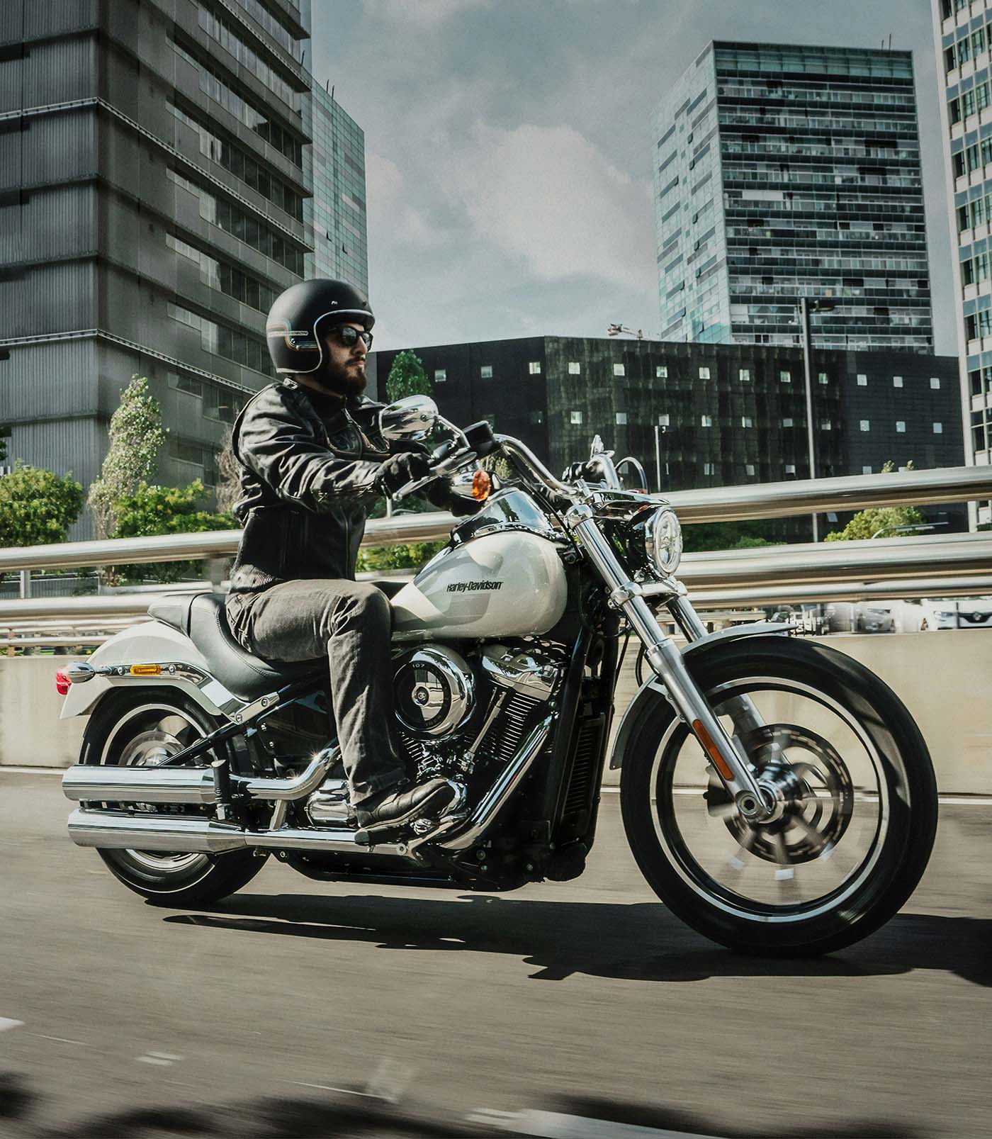 Motorcycle rider traveling through city traffic