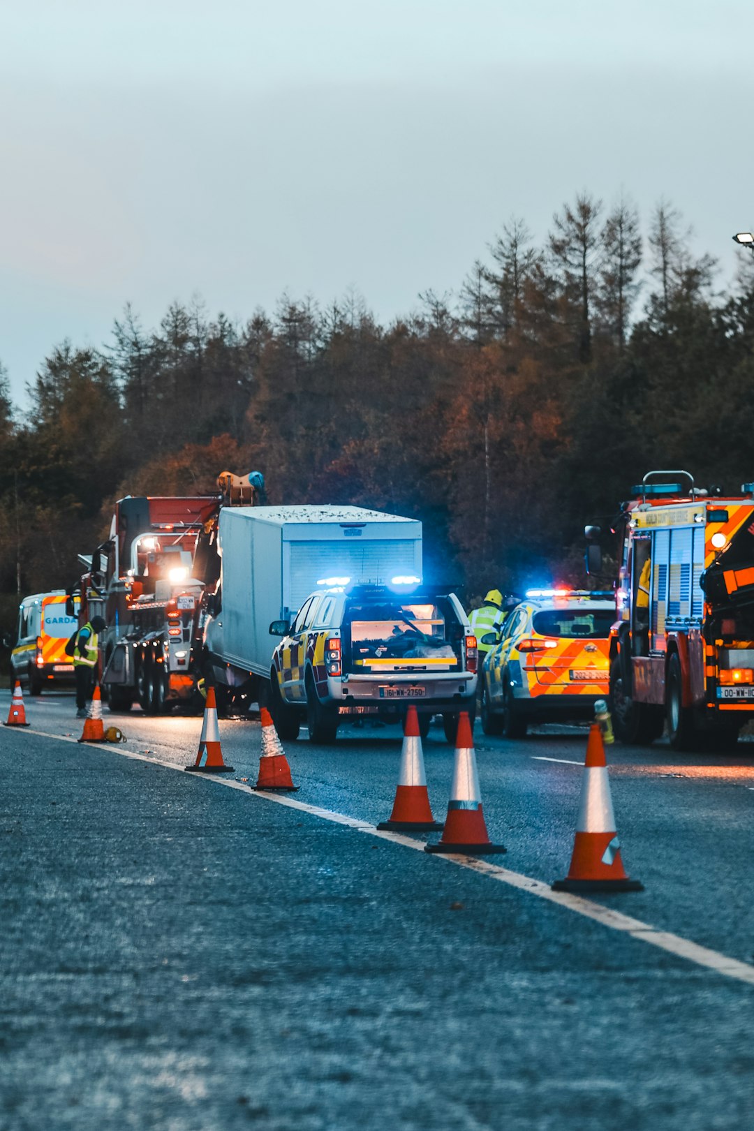 Emergency vehicles responding to a serious road accident scene, representing car and truck injury claims in Anchorage, Alaska