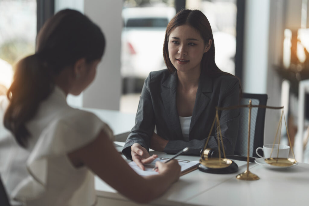 A woman consults with an attorney about the requirements and timeline for a wrongful death lawsuit.