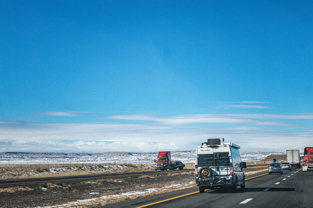Colorado interstate highway in winter conditions near open mountain terrain
