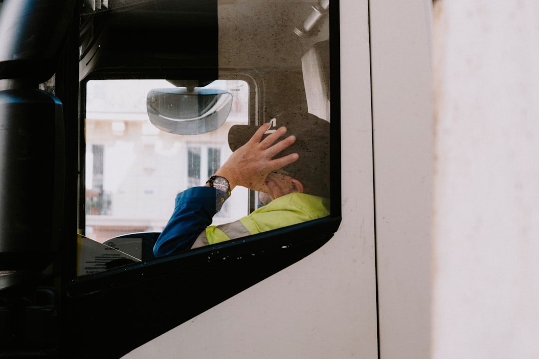 Commercial truck driver inside a semi cab, illustrating trucking safety and liability issues