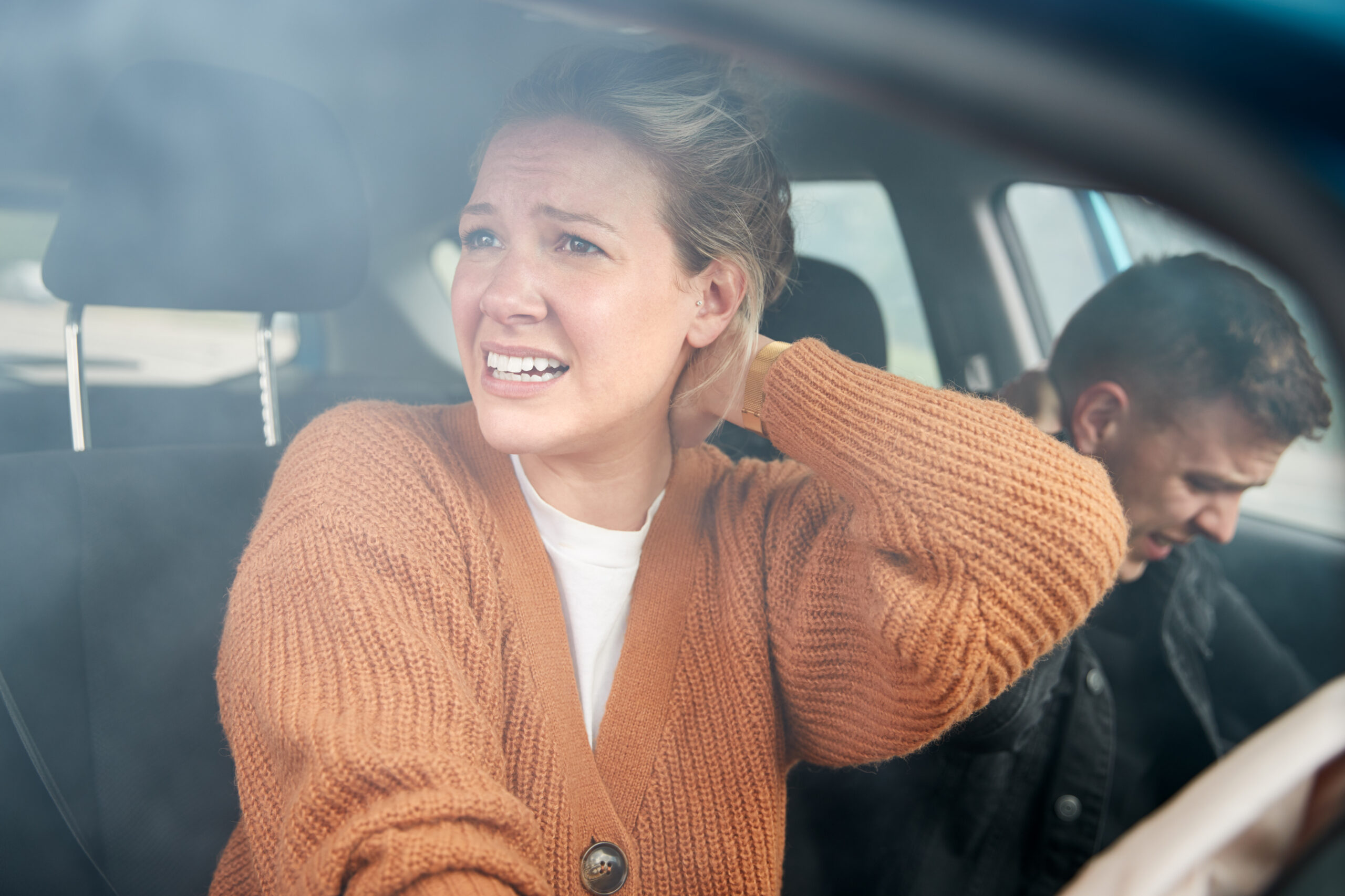 Worried couple in car after an accident