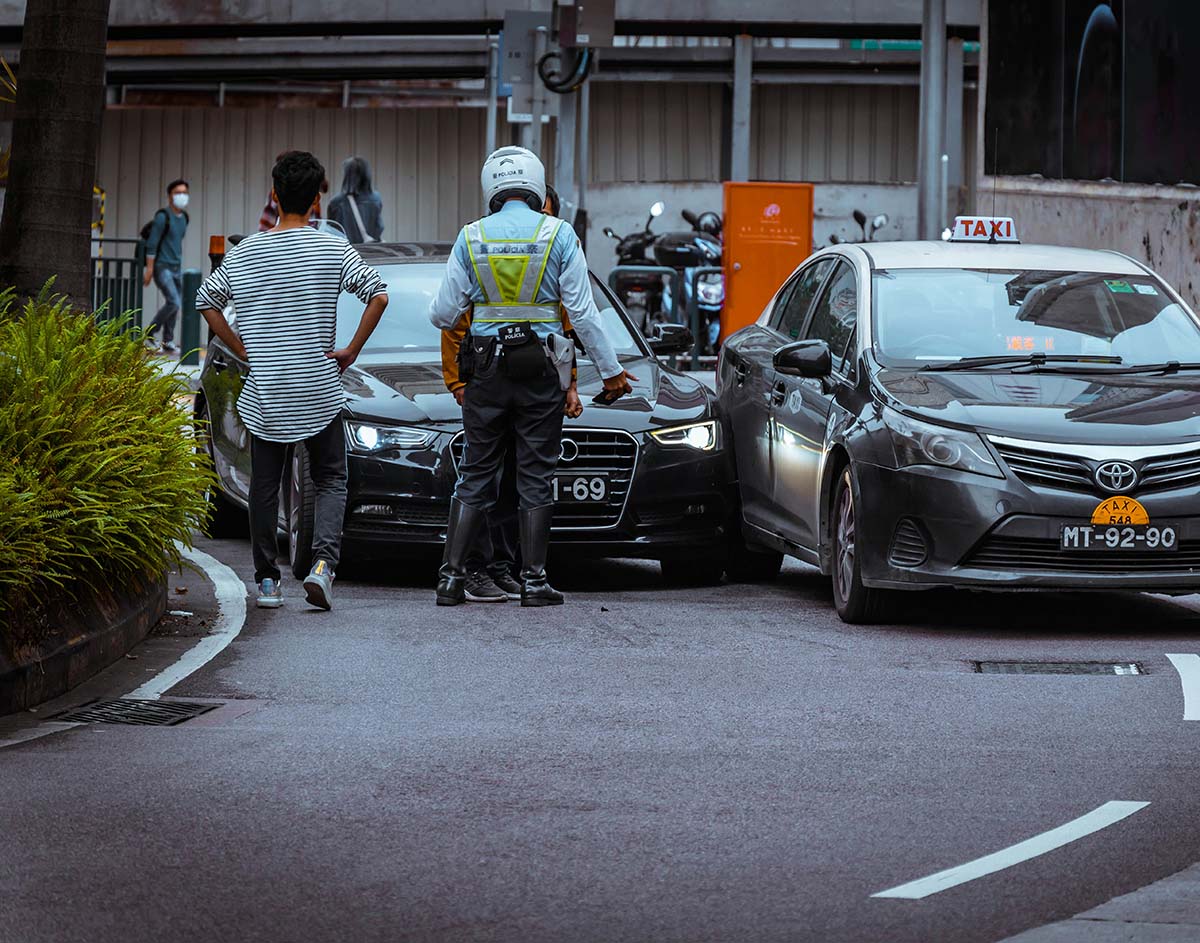 Police officer documenting a Redmond car accident scene.