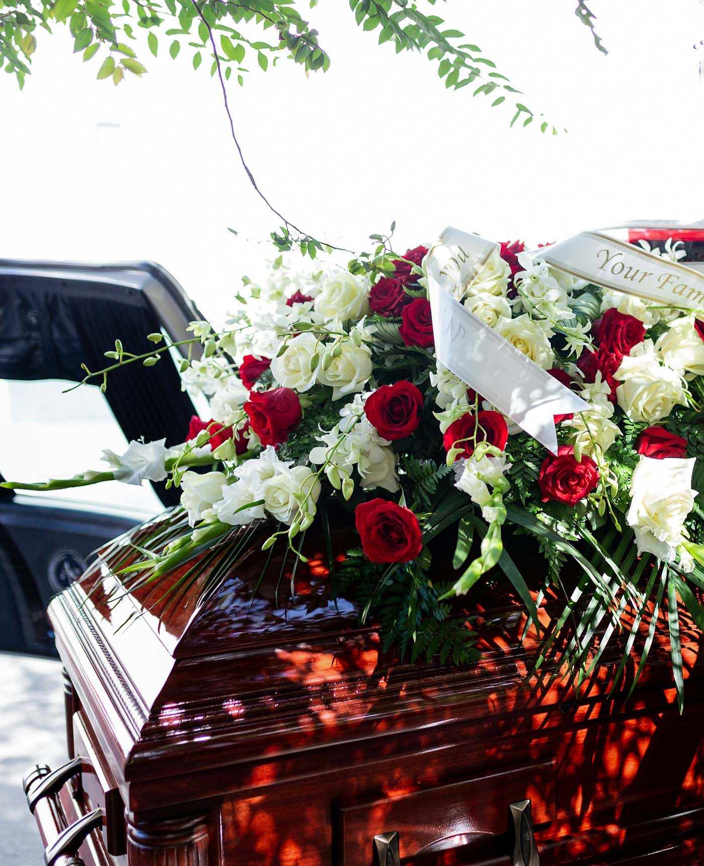 Casket with funeral flowers representing legal support from a Tacoma wrongful death attorney.