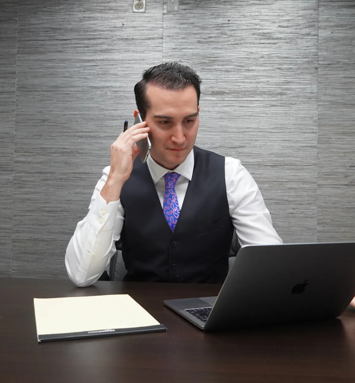 Strong Law attorney speaking with a prospective client by phone