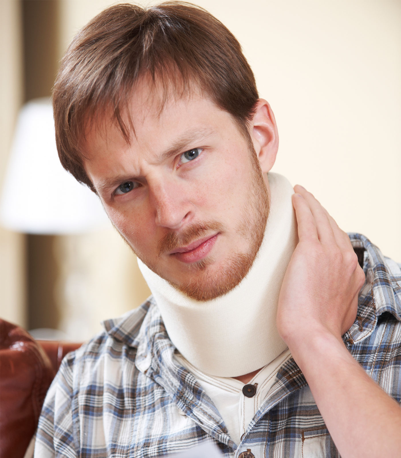 Man wearing a cervical collar after a neck injury